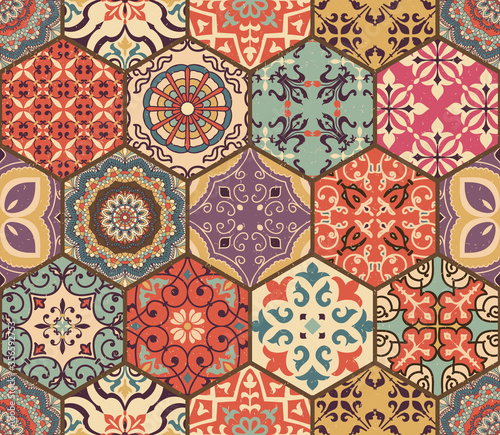 Seamless colorful patchwork tile with Islam, Arabic, Indian, Ottoman motifs. Majolica pottery tile. Portuguese and Spain decor. Azulejo. Ceramic tile in talavera style. Boho pattern