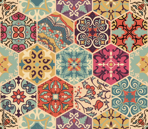 Seamless colorful patchwork tile with Islam, Arabic, Indian, Ottoman motifs. Majolica pottery tile. Portuguese and Spain decor. Azulejo. Ceramic tile in talavera style. Boho pattern