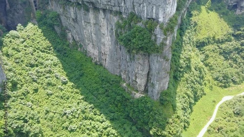 Aerial view of the stunning gorge valley surrounded by karst limestone rock formations in Wulong National Park, China photo