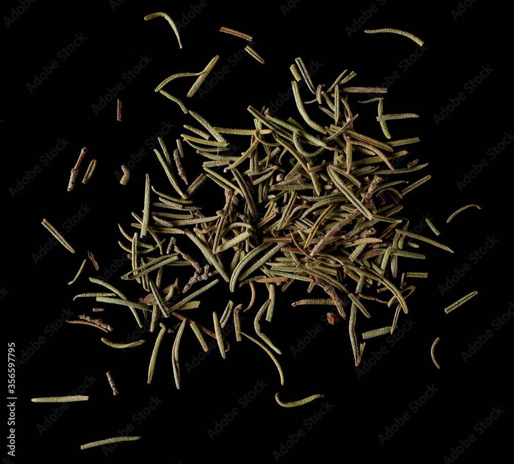 Dry rosemary pile isolated on black background, top view