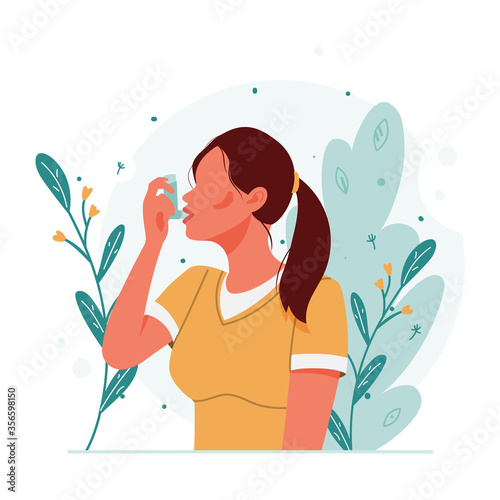 Woman uses an asthma inhaler against an allergic attack