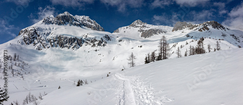 Panoramic winter view of the Poncione di Cassina Baggio from the Piansecco hut in the Bedretto valley in Switzerland.