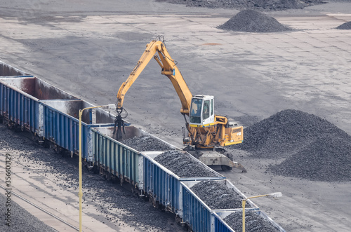 TRANSSHIPMENT YARD - Unloading of freight wagons at a storage yard photo