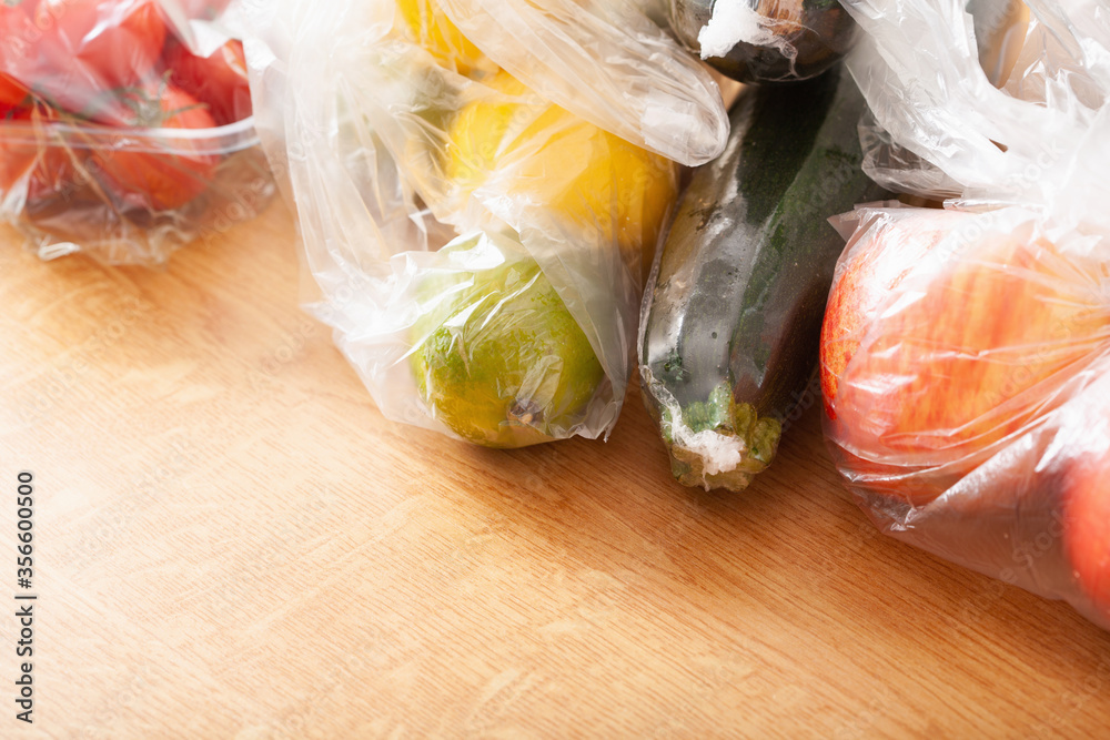 single use plastic waste issue. fruits and vegetables in plastic bags