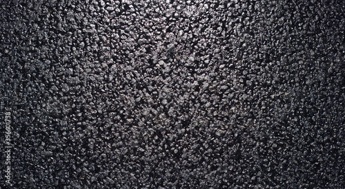 Texture of fresh and new black asphalt. Background of new asphalt