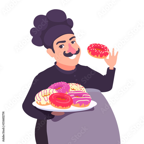 A cute confectioner baker holds a plate of various glazed doughnuts in his hand. A chef cook showing a donut, smiling. Delicious donuts.