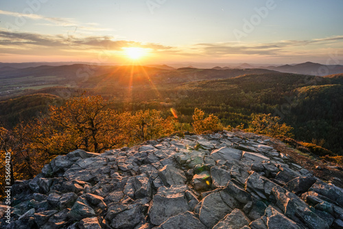 Bild auf Leinwand Sunset sunrise from mountain hill Klic to the Luzicke mountains