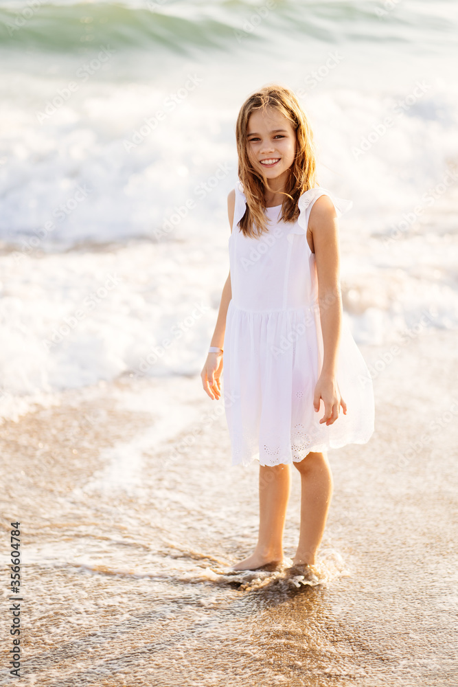 girl walks and fun on sea shore with big waves and strong winds. girl walks and fun on sea shore with big waves and strong winds.