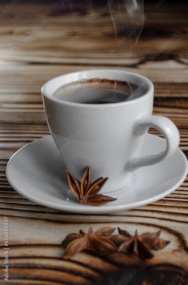 espresso on wooden background with star anise and cinnamon espresso on wooden background with star anise and cinnamon