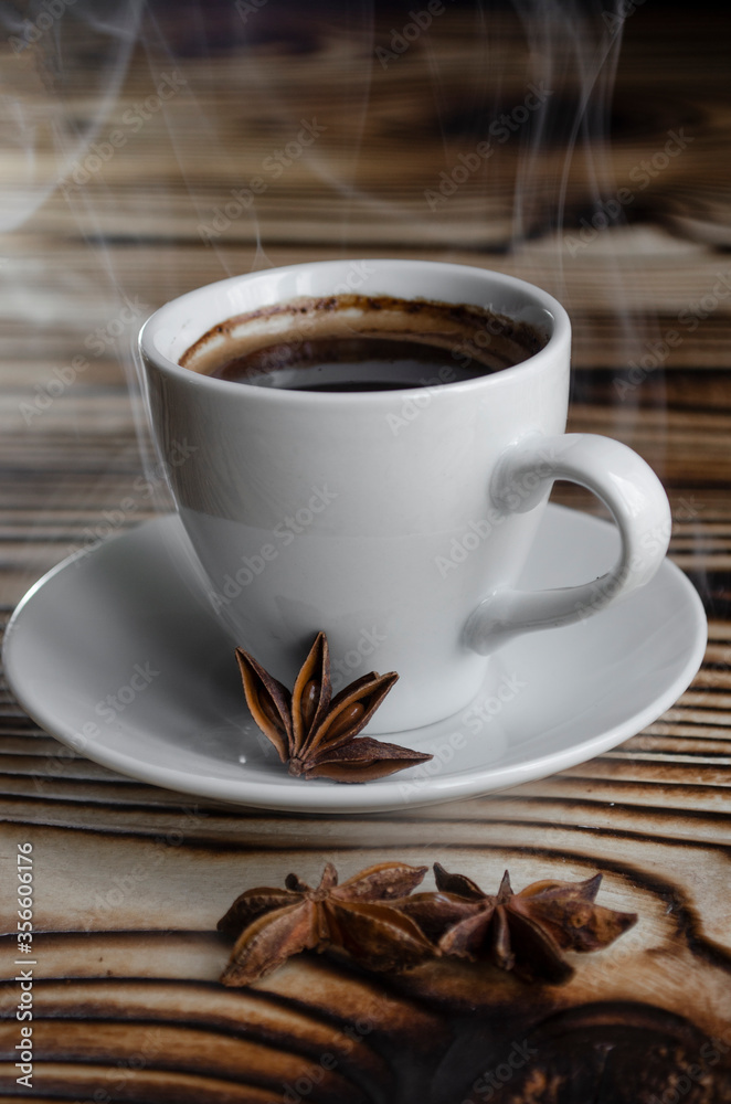 espresso on wooden background with star anise and cinnamon espresso on wooden background with star anise and cinnamon