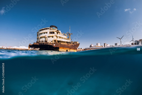 Telamon wreck ship in blue ocean. Split shot. Lanzarote © artifirsov