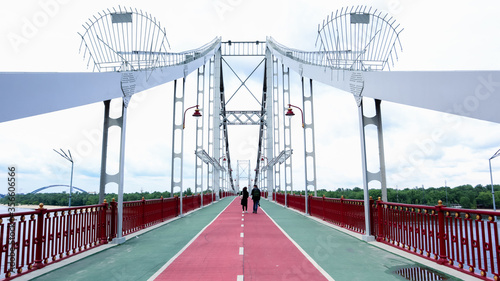 Park pedestrian bridge over the Dnieper River, which connects the central part of Kiev with the park area and the beaches of Trukhanovy Island. Without people.