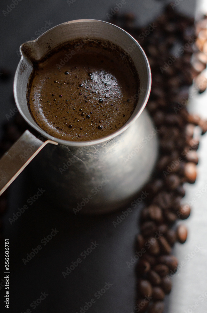 Fototapeta premium coffee cezve with fresh coffee and beans