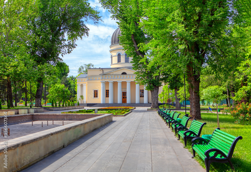 Central park and cathedral in Chisinau , pedestrian pavement and benches in the city park