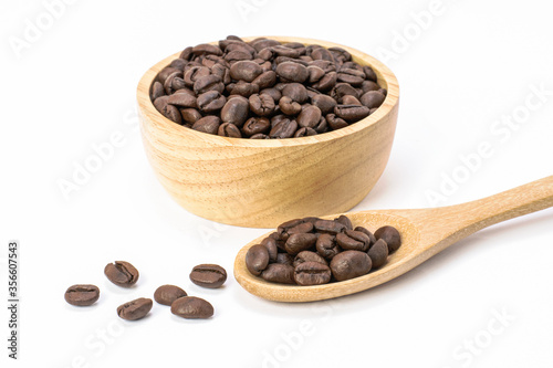 coffee beans in a wooden scoop and bowl isolated on white background.