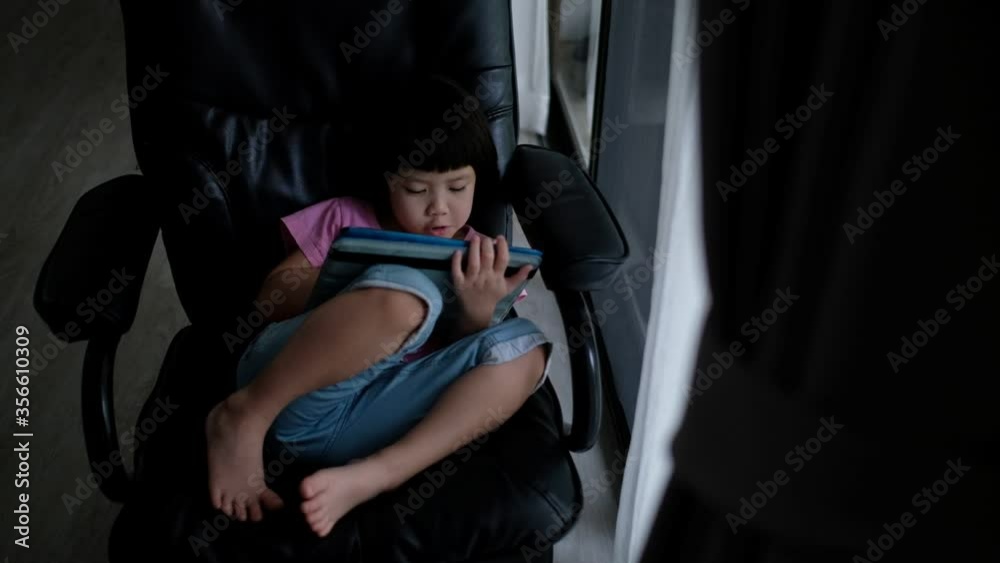 child addicted tablet, asian girl playing smartphone, kid use telephone, watching cartoon child addicted tablet, asian girl playing smartphone, kid use telephone, watching cartoon