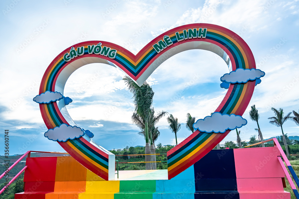 Abstract heart-shaped rainbow bridge in the park, which attracts visitors to take pictures and memories in the tourist city of Da Lat, Vietnam