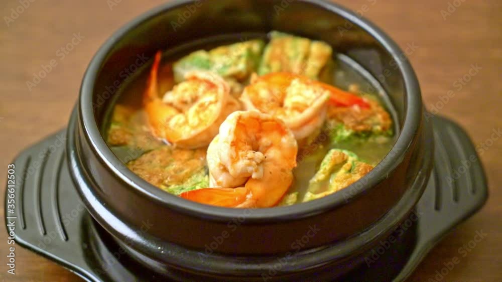 Sour soup made of Tamarind Paste with Shrimps and Vegetable Omelet - Asian food style Sour soup made of Tamarind Paste with Shrimps and Vegetable Omelet - Asian food style