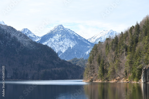 Crystal pure lake in the middle of Alps. The Neuschwanstein city in Germany.