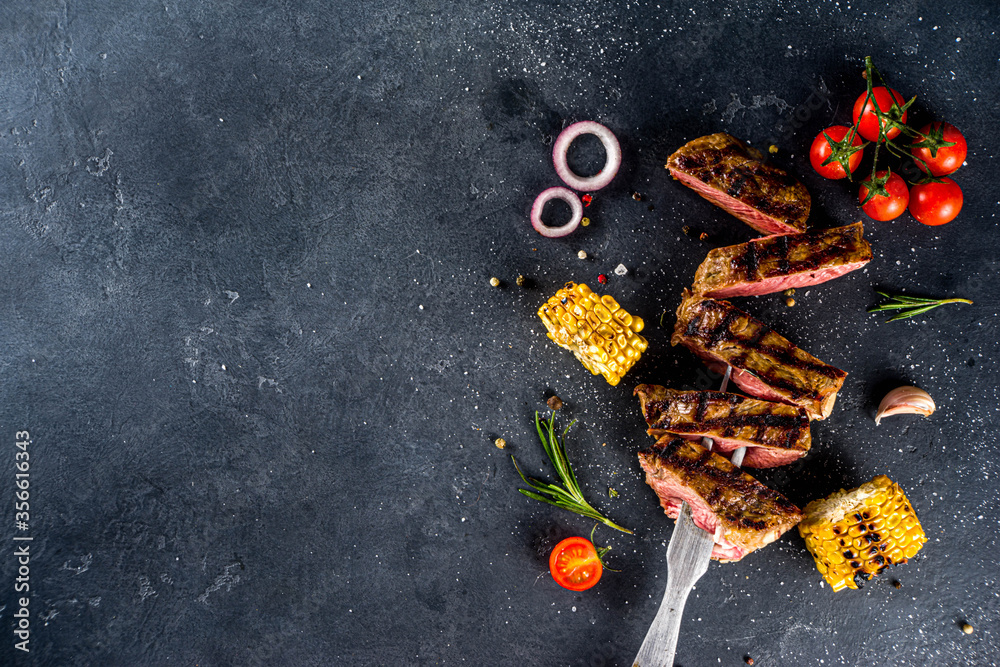 Cooking meat background. Fresh grilled meat on dark grey table ...