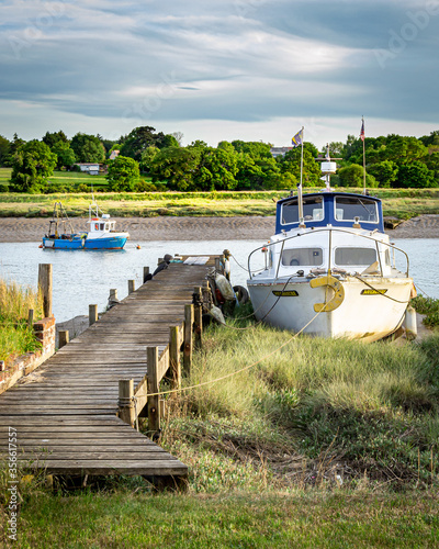 Boat stranded on bank at low tide photo