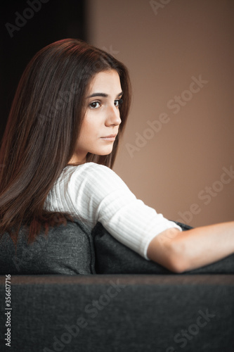 Young woman pretty relaxing on couch in living room