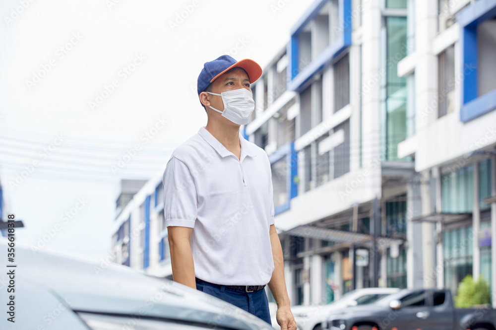 Men are standing outdoors, wearing masks to protect against germs and viruses. Prevent dust and prevent toxic fumes. Men are standing outdoors, wearing masks to protect against germs and viruses. Prevent dust and prevent toxic fumes.