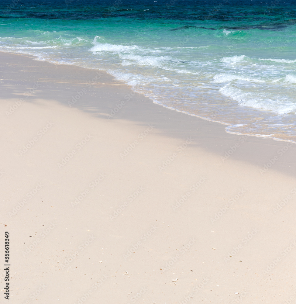 Soft wave of blue ocean sea on sandy beach Soft wave of blue ocean sea on sandy beach