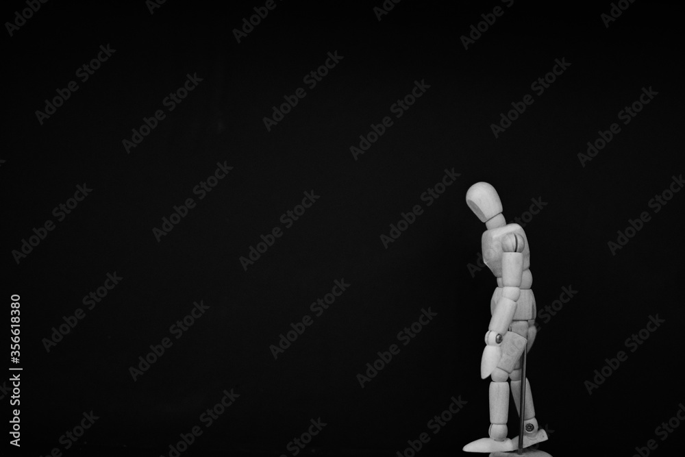 wooden mannequin standing on black background with walking man pose wooden mannequin standing on black background with walking man pose