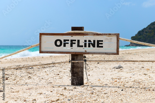 Old wooden sign with text offline on tropical beach #356618395