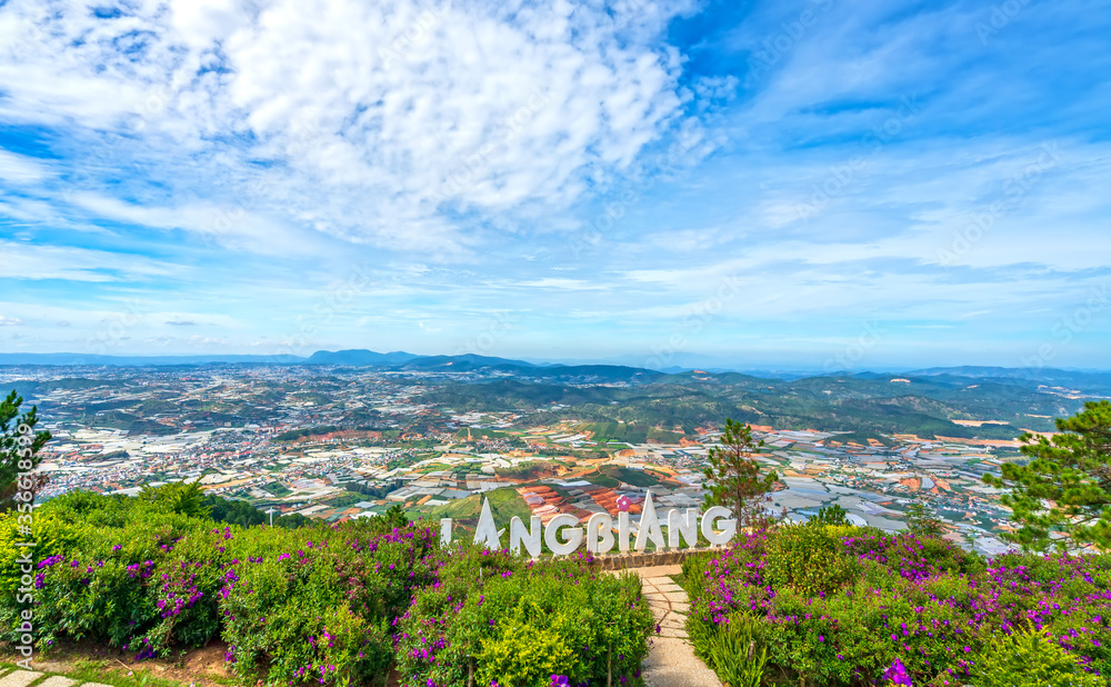 Landscape top Mount Langbiang, below are vegetable gardens, flower farming food supply for whole region, place of excursions, central highlands in Da Lat, Vietnam