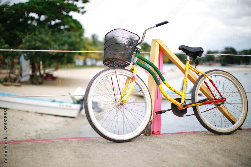 Old bicycle with colorful tradition Caribbean style in Mexico on the beach Old bicycle with colorful tradition Caribbean style in Mexico on the beach