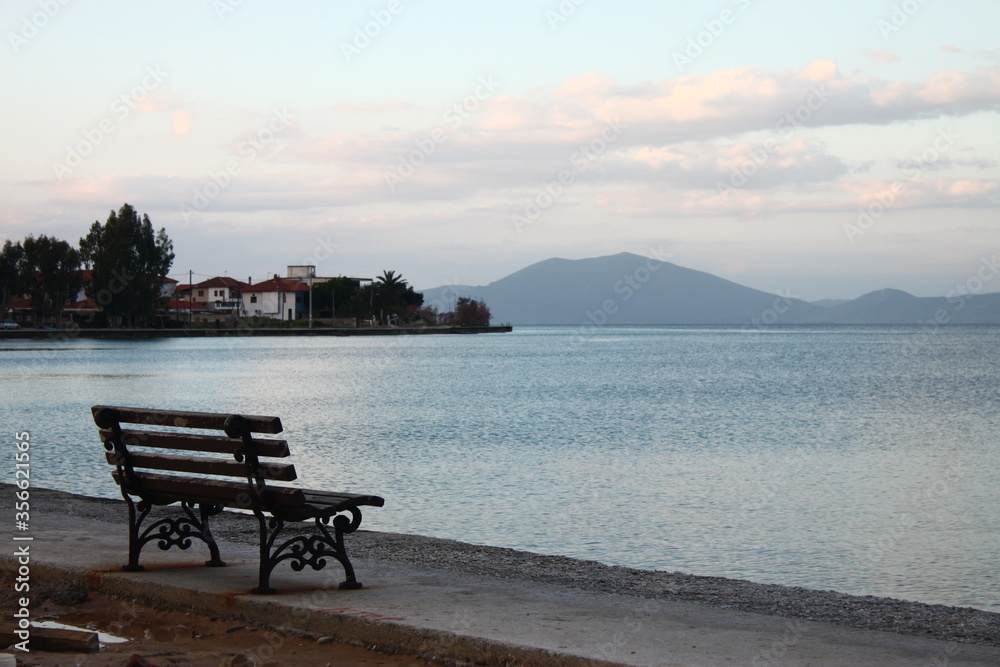 An empty bench in front of the sea 