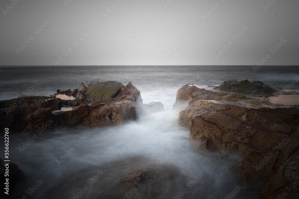 Waves crashing on rocks Waves crashing on rocks