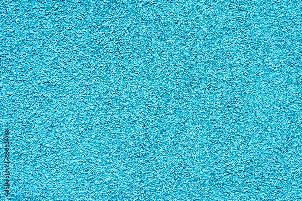 Grain cyan blue paint wall background or texture.Outdoor image. Grain cyan blue paint wall background or texture.Outdoor image.