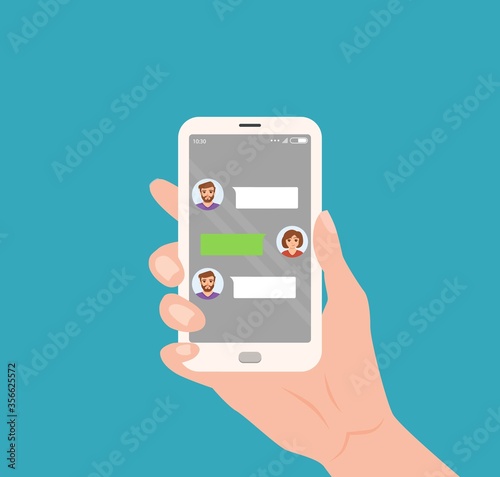 Hand holding mobile with live chat messenger app on screen.