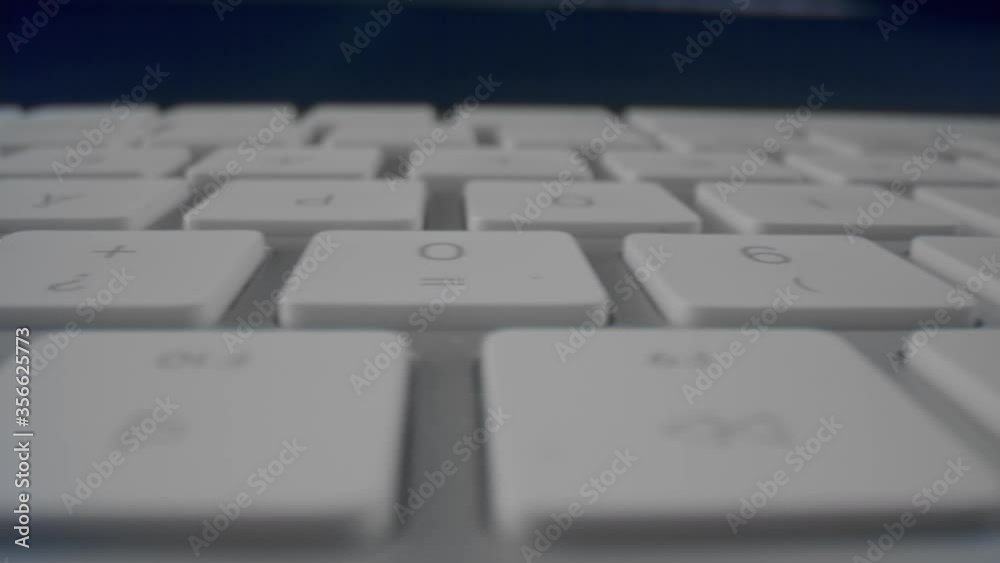 Computer keyboard with white keys. White buttons of computer keyboard in detail Computer keyboard with white keys. White buttons of computer keyboard in detail