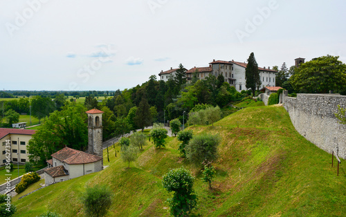 The landscape near Spilimbergo in the Udine province of north Italy, viewed from Terrazza Panoramica/panoramic terrace. The town's historic walls are on the right & the castle in background right