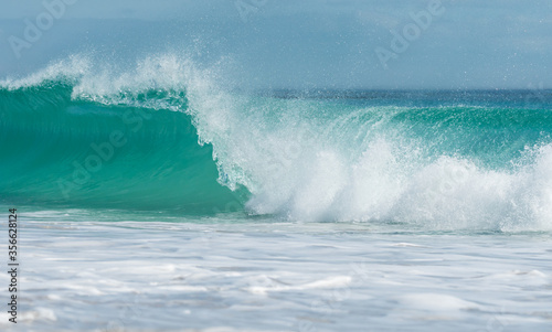 turquoise wave or roller breaking in the ocean concept tropical Summer holiday or vacation