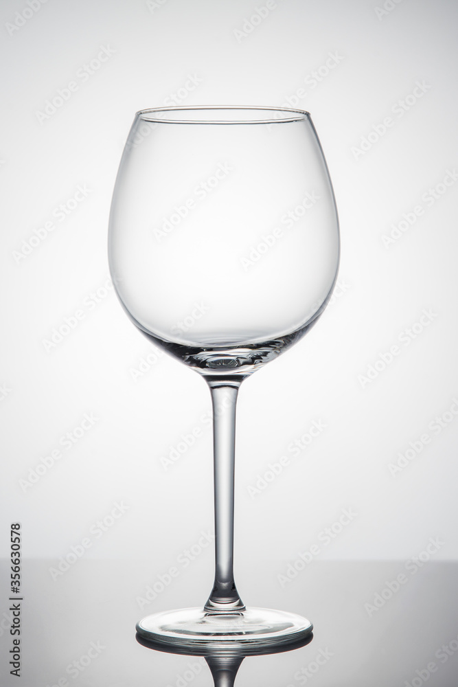 Empty glass of wine on a white background Empty glass of wine on a white background