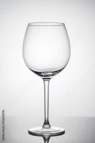 Empty glass of wine on a white background