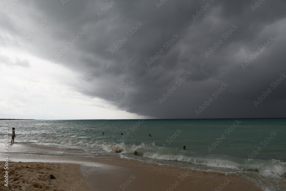 storm on the beach with dark clouds in Dominican republic.