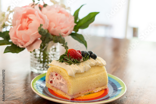 Cake Rolls decorated with fruit  strawberry  blueberries  raspberries.