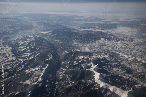 Snowcapped mountains photographed from a plane
