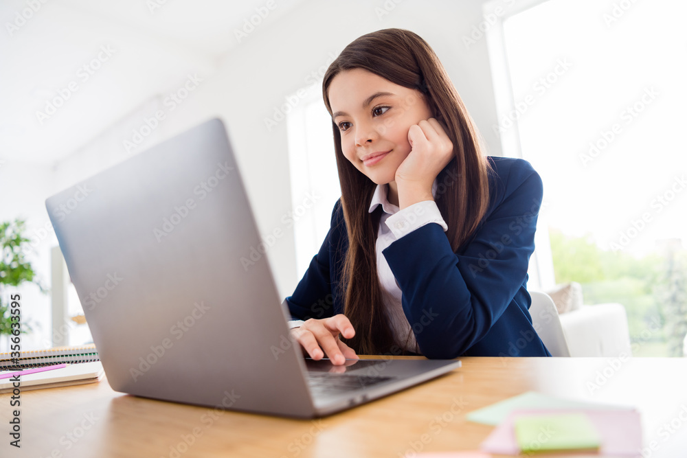 Photo of little pretty pupil student girl interested look notebook online lesson listen teacher distance quarantine study september autumn stay home living room classroom indoors Photo of little pretty pupil student girl interested look notebook online lesson listen teacher distance quarantine study september autumn stay home living room classroom indoors