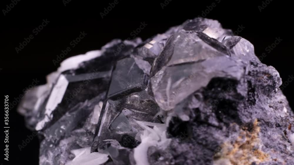 Cerussite crystals macro video slowly rotating over a black background