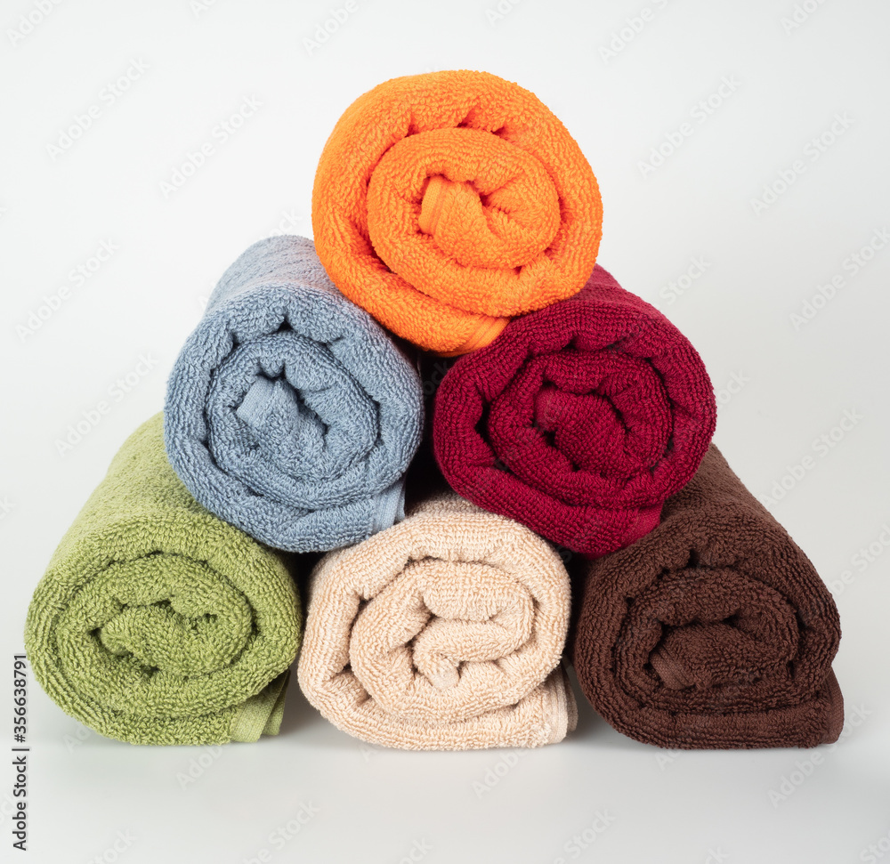 multicolored towels on a white background multicolored towels on a white background