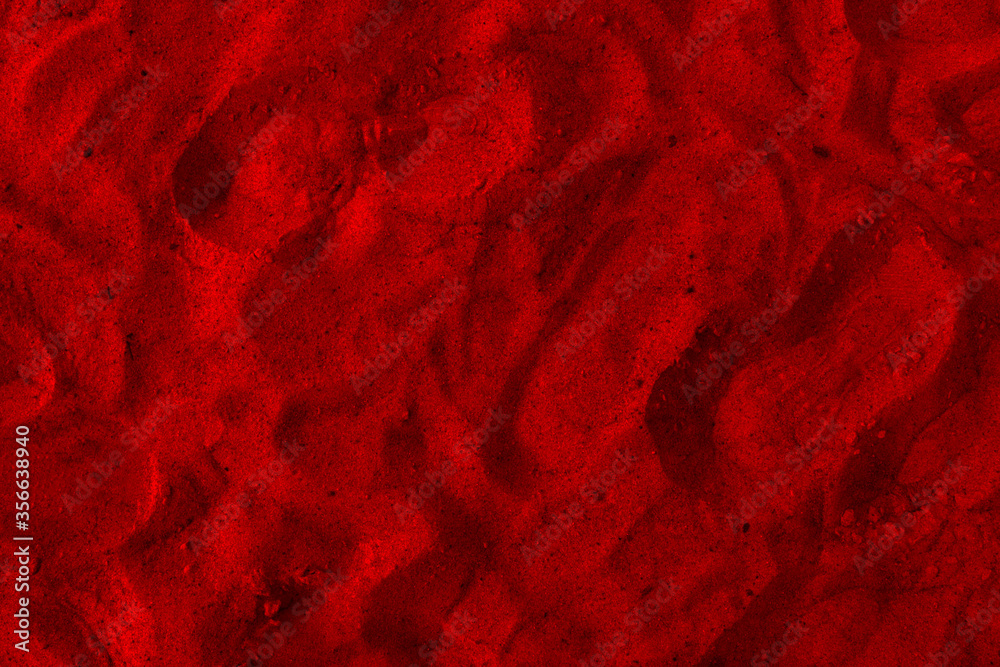 Closeup image of beautiful red sand grains with patterns for background.
