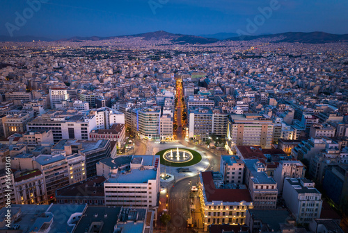 Fototapeta Naklejka Na Ścianę i Meble -  Omonia square at Athens on night twilight time. Aerial view, look down with streets light and traffic