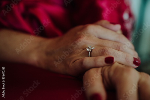 the bride wears a wedding ring on her finger